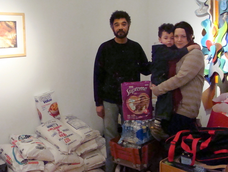 Carlo, Karen and son, Rico Thertus are accepting goods and supplies to send to Haiti, where Carlo's brother lives.